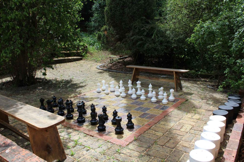 Outdoor chess set in the courtyard at Heath Farm Holiday Cottages