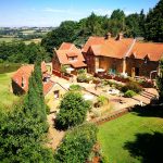 Heath Farm Holiday Cottages Courtyard with views of rolling Cotswold Hills